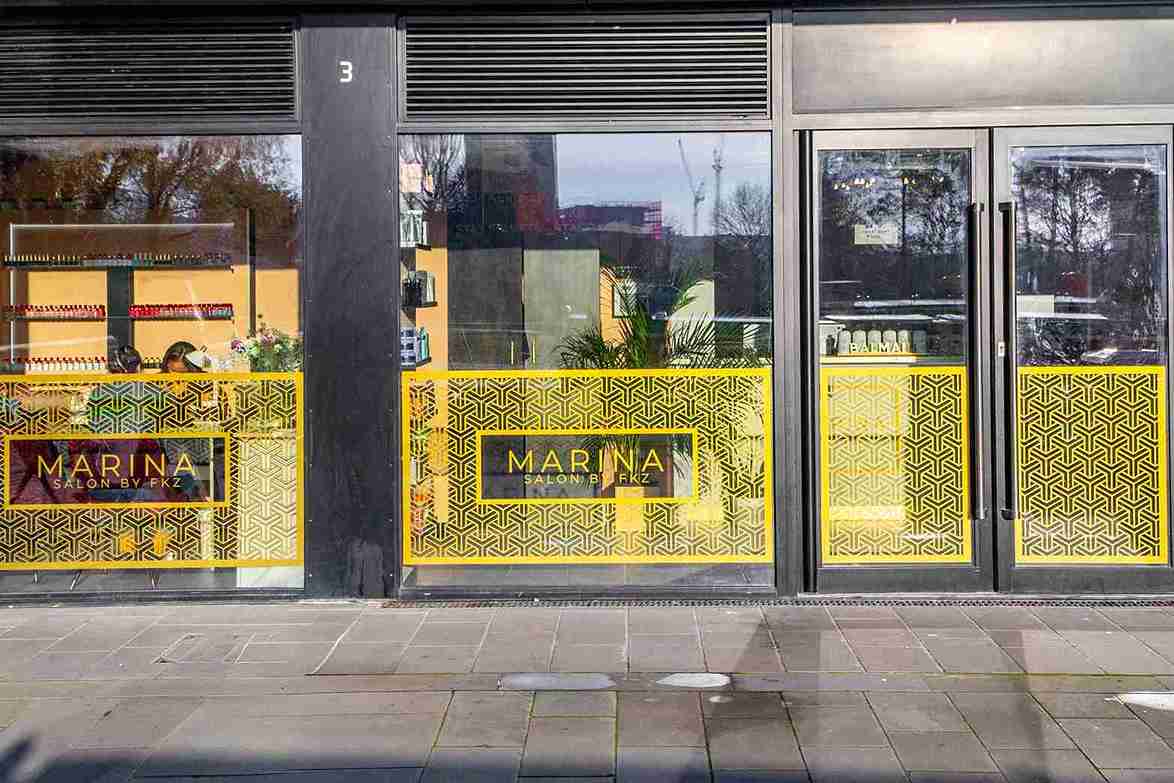 Salon by FKZ modern storefront exterior with signature gold branding